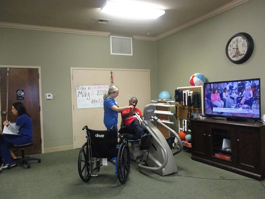 resident and therapist exercising